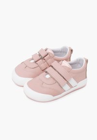 Pale pink synthetic shoes with two Velcro straps, white accents, rounded toe, and textured side detailing. White rubber sole for traction.