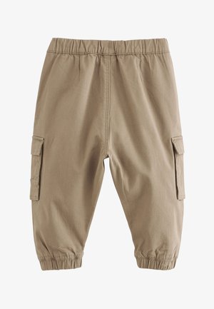 Beżowe bawełniane spodnie cargo z elastycznym pasem, marszczonymi mankietami i bocznymi kieszeniami. Gładka faktura i luźny krój zapewniają komfort.