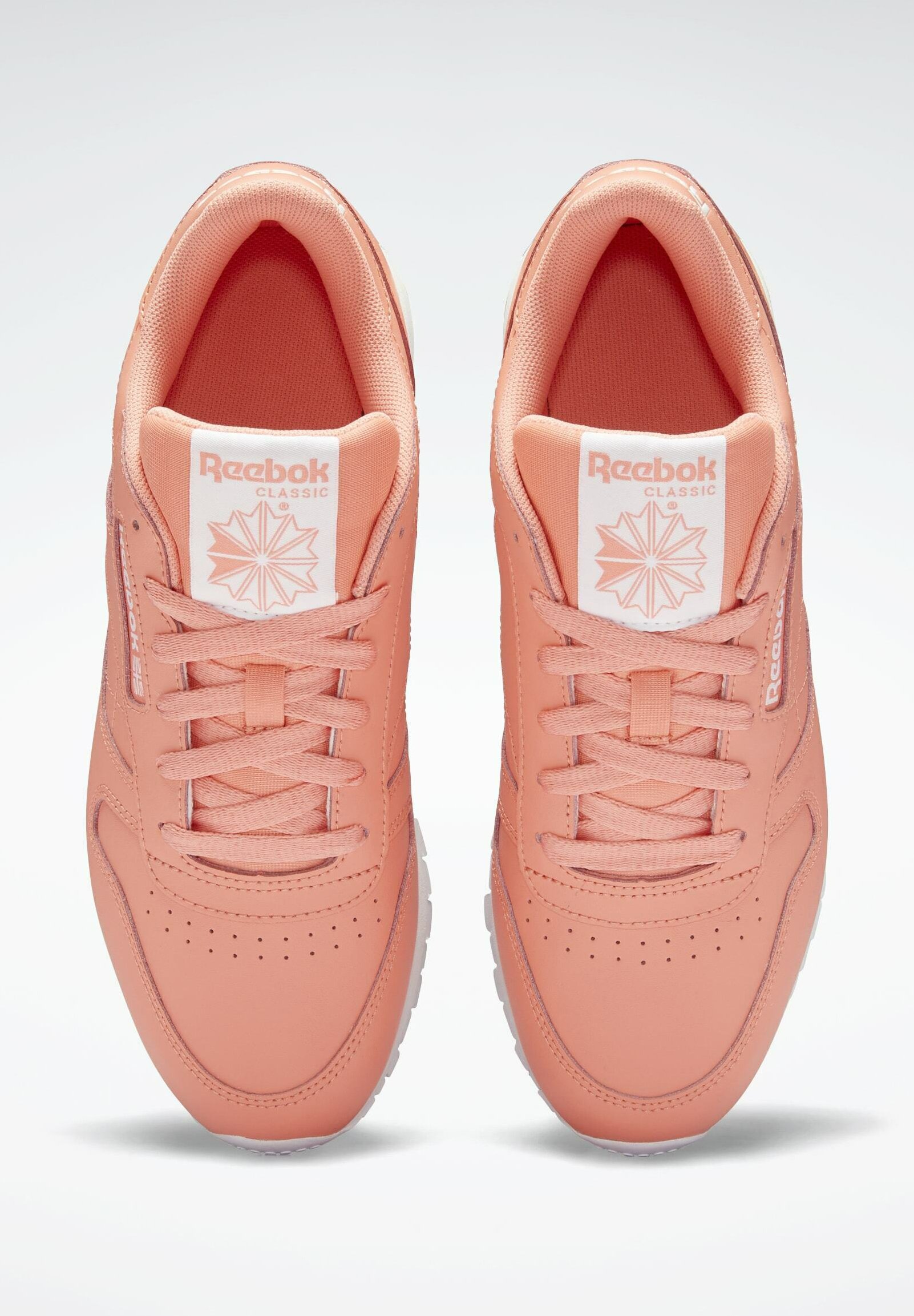 peach reebok trainers