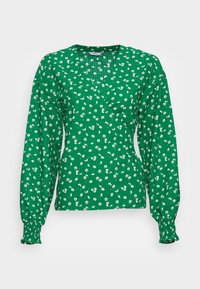 Blusa verde de manga longa com um design envolvente, apresentando padrões florais brancos, tecido texturizado e punhos franzidos.