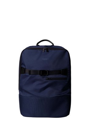 Navy blue rectangular backpack with top handle, front zipper pocket, and black adjustable strap with buckle across the front.