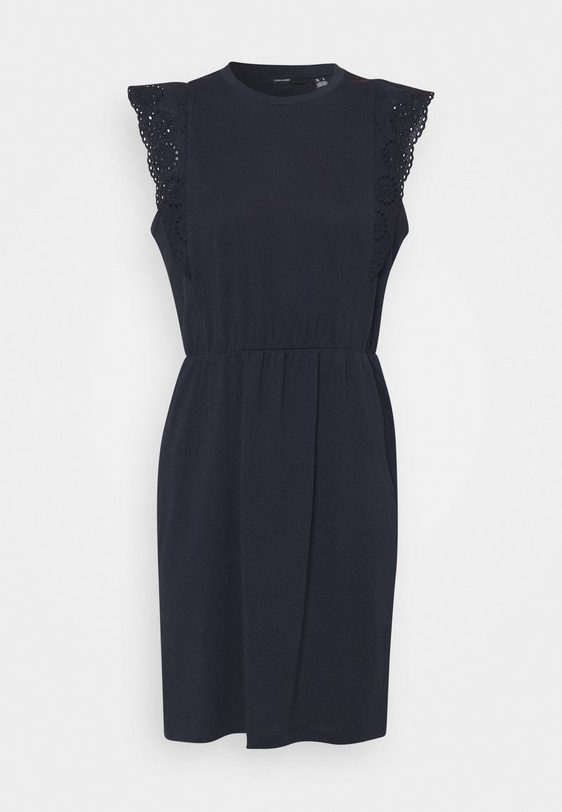 Laivaston sininen mekko lyhyillä hihoilla, jossa on hienovaraiset pitsikoristeet. Rypytetty vyötärö ja kellotettu helma; pehmeä, kevyt kangas.