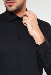Seidensticker SLIM - Camicia elegante - schwarz