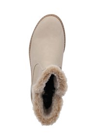 Beige enkelboot met een gladde buitenkant, voorzien van een zachte bontvoering aan de bovenkant en contrasterende stiksels langs de zool.