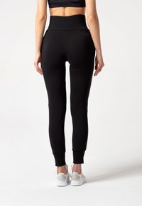 Carpatree BELLE - Verryttelyhousut - black