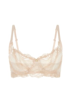 Kanten bralette in zacht nude, met golvende randen, doorzichtige meshpanelen en verstelbare bandjes met een centrale decoratieve knop.