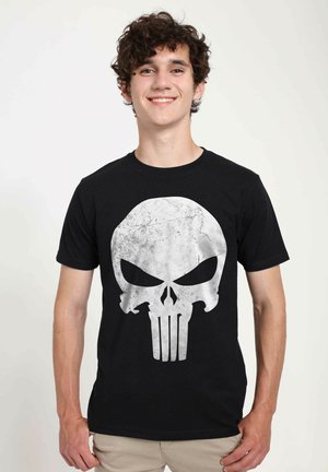 Black cotton t-shirt featuring a large, distressed gray skull graphic with prominent eye sockets and vertical lines at the base.