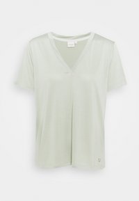 Lichtgroen V-hals T-shirt gemaakt van zachte stof, met korte mouwen en een losse pasvorm. Klein logodetail vlak bij de zoom.