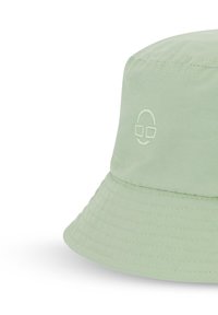 Ljusgrön bucket hat i slät tyg, med en sydd kant och ett litet broderat ansikte med glasögon på sidan.