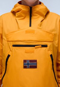 Yellow waterproof jacket with a half-zip design, featuring a patch pocket, black zipper accents, and a decorative Norway flag patch.
