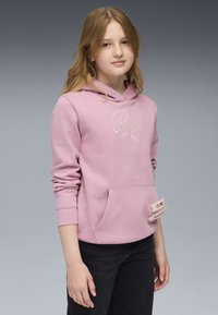 Hellrosa Kapuzenpullover mit Kängurutasche, ausgestattet mit einem weißen bestickten Logo und einem beaded Akzent auf der Tasche. Stoffgemisch aus Baumwolle.