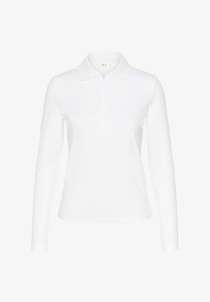 Valge pika varrukaga polo särk, millel on tõmblukk-krae, ribaliselt tekstuur ja keha lähedane siluett, valmistatud siledast, venivast materjalist.