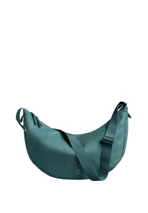 Borsa a tracolla color verde acqua a forma di mezzaluna con tracolla regolabile e chiusura con cerniera, con il logo "GOT BAG" discreto al centro anteriore.