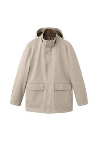 Jasnobeżowa kurtka z kapturem, z suwakiem z przodu pod klapką oraz dwiema dużymi kieszeniami na froncie, długimi rękawami i wysokim kołnierzem.