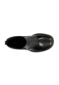 Černá kožená slip-on obuv s kulatou špičkou, hladkým povrchem a minimálním prošíváním. Obsahuje malou poutko na patě pro snadné nazouvání.