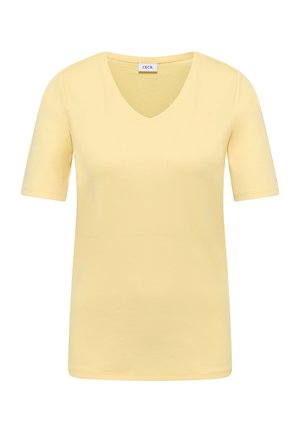 Camiseta amarilla de manga corta con escote en V con etiqueta de la marca CECIL en el interior del cuello, mostrada sobre un fondo blanco liso.