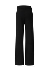 Schwarze Hosen mit weitem Bein, glatter Textur, elastischem Bund und ohne sichtbare Taschen, entworfen für Komfort und Bewegungsfreiheit.