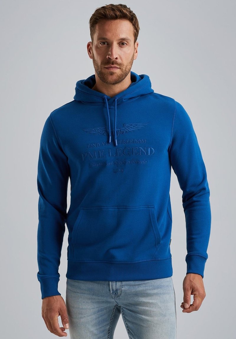Blue hooded sweatshirt with a front kangaroo pocket, ribbed cuffs, and hem. Features embossed logo text on the chest. Cotton blend fabric.