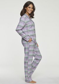 Plaid pajama set in lavender, green, and gray tones. Soft fabric, button-up top with long sleeves, and straight-leg pants with side pockets.