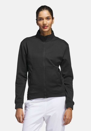 Black zip-up jacket with high collar, made of smooth fabric. Features two front pockets and ribbed cuffs. Simple, functional design.