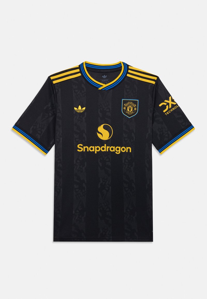Melnā futbola krekla ar tekstūrētām svītrām, kuram ir dzelteni akcenti, apaļš apkakle ar zilu apdari un Adidas un Snapdragon logotipi.