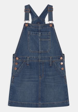 Robe salopette en denim avec bretelles ajustables, poche avant sur le plastron, boutons sur les côtés et deux poches avant inclinées.
