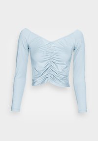 Top cropped azul céu, de manga longa, com decote em V e detalhe de franzido central. Confeccionado em tecido suave com uma textura lisa.