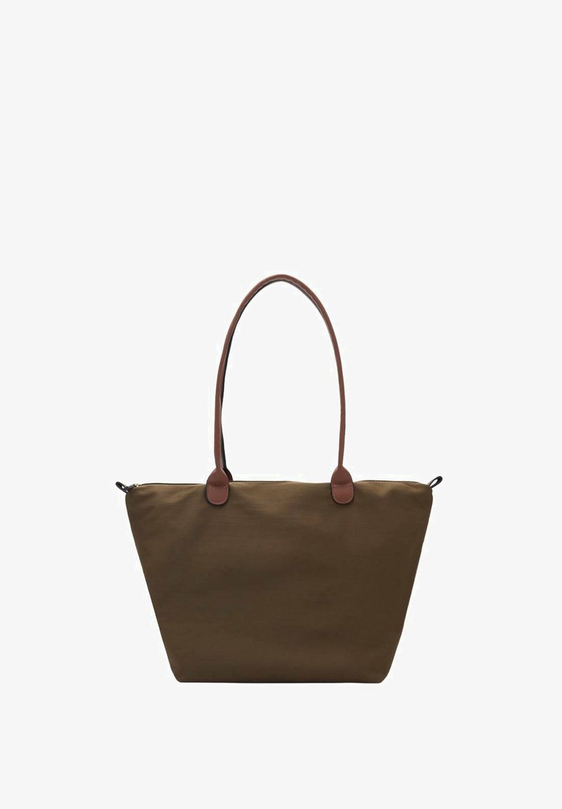 Brown fabric tote bag with leather accents, a wide open top, two long handles, and a structured, angled design. Features a zipper closure.