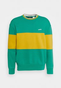 Sweat-shirt à col rond avec une large bande horizontale jaune traversant la poitrine et les manches, corps bleu sarcelle, et petit logo blanc Levi's sur la poitrine.