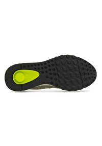 Suola di scarpa in gomma nera con grip testurizzato, caratterizzata da un accento circolare verde. Design liscio con bordi arrotondati e struttura flessibile.
