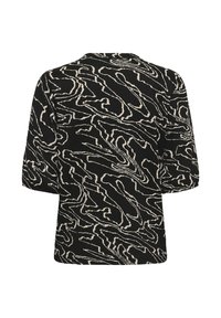 Haut noir à manches courtes avec une coupe ample et un motif abstrait de lignes ondulées beiges sur l'ensemble.