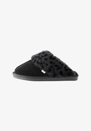 Black slipper with a faux fur upper, soft texture, and a solid black suede base. Features a flat rubber sole and subtle stitching details.