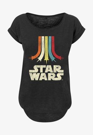 Mustat T-paita, jossa on pyöreä kaula-aukko ja lyhyet hihat. Paidassa on retrohenkinen monivärinen kuvitus tyylitellyistä avaruusalusta ja "STAR WARS" -teksti.