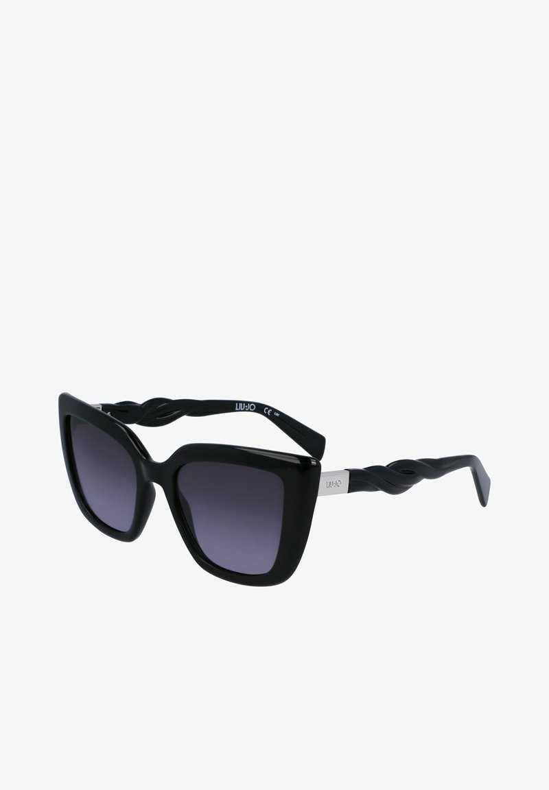 Black oversized sunglasses with a glossy finish, thick frame, gradient purple lenses, and uniquely twisted black temples. Silver logo detail on side.