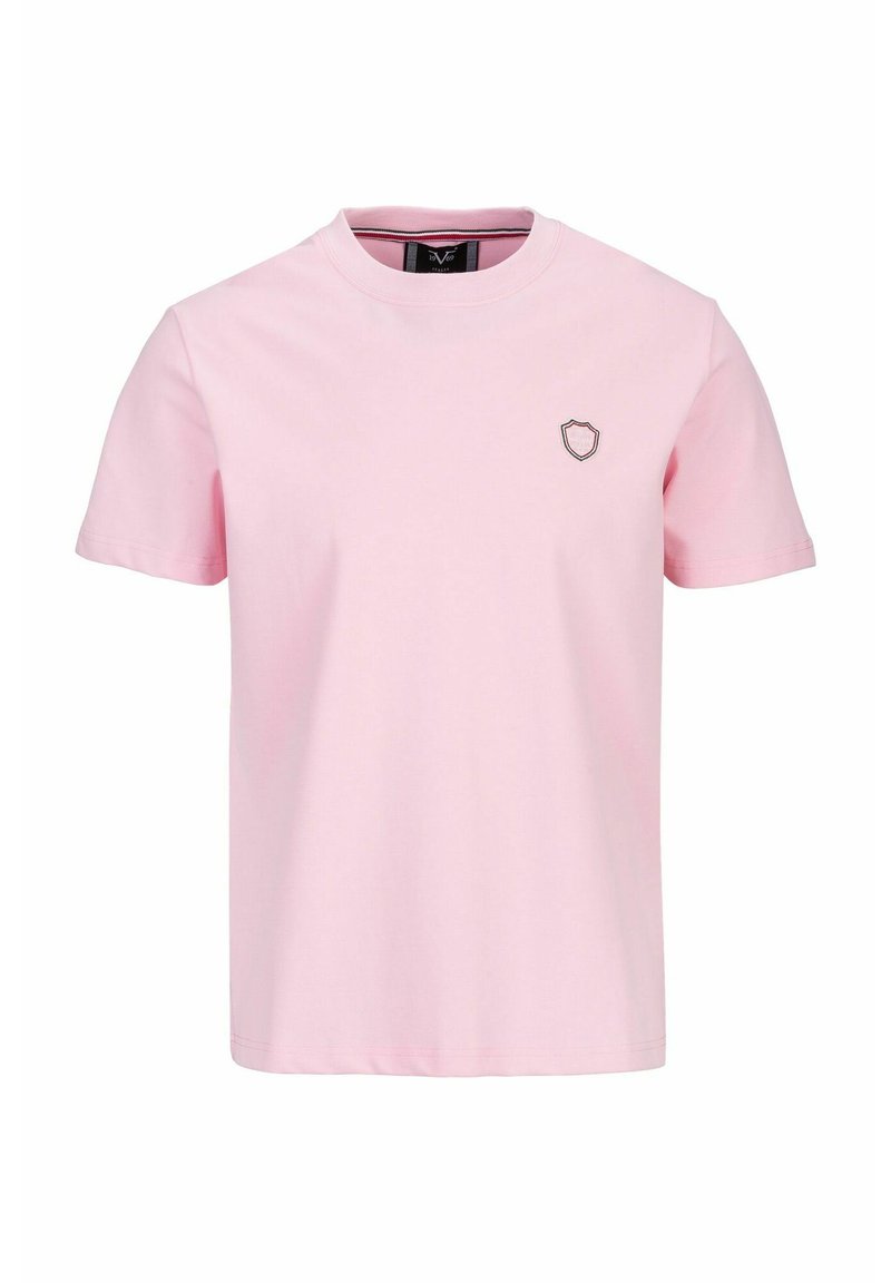 Rosa Baumwoll-T-Shirt mit Rundhalsausschnitt und kurzen Ärmeln, verziert mit einem kleinen Wappen-Logo auf der linken Brust. Weiche Textur.