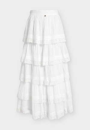 Falda larga blanca de varios niveles con encaje en cada capa, tela fruncida y cinturilla con botones.