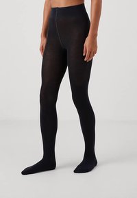 Ciorapi opaci negri cu talie înaltă, realizați dintr-un material moale și elastic, cu o textură netedă și o siluetă ajustată.