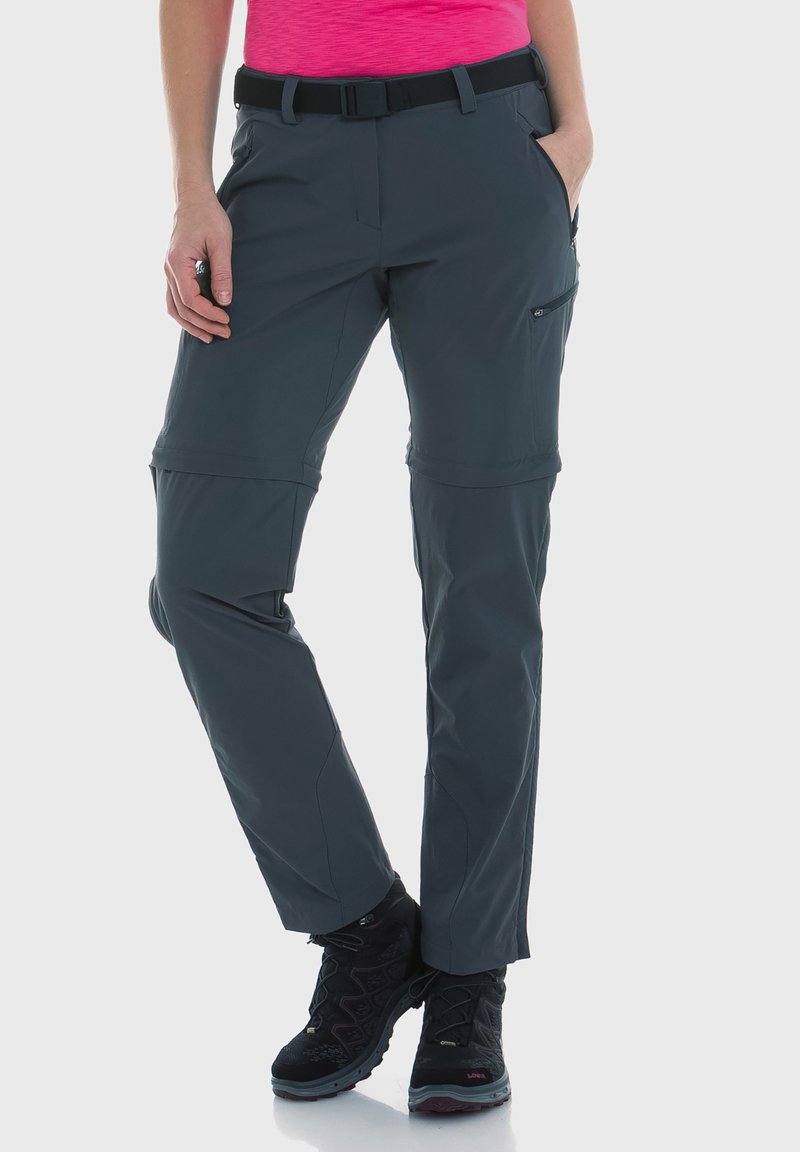 Konwertowalne spodnie outdoorowe w ciemnoszarym kolorze, z paskiem, kieszeniami na zamek oraz wyprofilowanymi kolanami dla zwiększonej swobody ruchów.