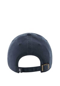 Navy blue cap featuring a rounded shape, fabric texture, adjustable strap with a metal buckle, and branding tag on the side.