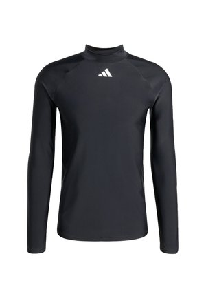 Crna majica dugih rukava izrađena od glatkog, rastezljivog materijala s visokim ovratnikom. Ima bijeli adidas logo na prsima i ravne šavove.