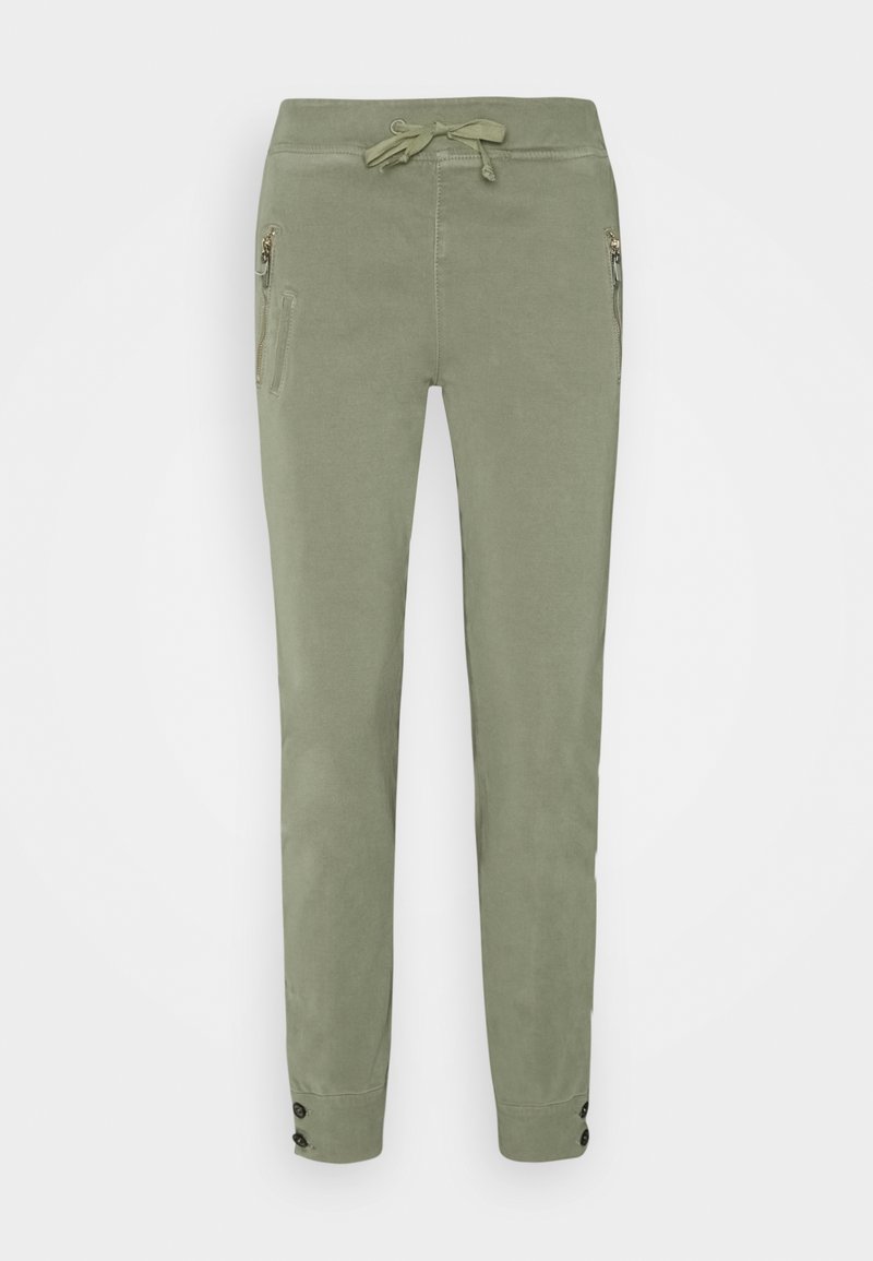 Lichtgroene broek van zacht materiaal, met een elastische tailleband, zijritsen en knoopaccenten aan de zoom.