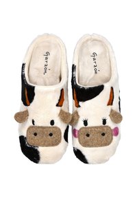 Zapatillas de casa con temática de vaca, suaves y esponjosas, confeccionadas con un tejido blanco y negro, con detalles de fieltro para los ojos, las orejas y el hocico, y un diseño acogedor.