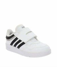 Sneaker bianco con tomaia in pelle liscia, caratterizzato da dettagli a strisce nere e una fascia in Velcro per la chiusura. Suola testurizzata per una buona aderenza.