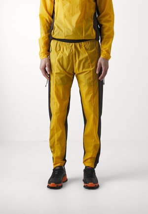 TROUSERS - Teplákové kalhoty - yellow/ brown