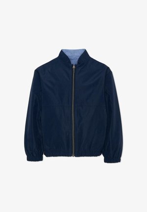 Granatowa lekka kurtka z pełnym zamkiem błyskawicznym z przodu, elastycznymi mankietami i dołem oraz stójką z jasnoniebieskim wewnętrznym wykończeniem.