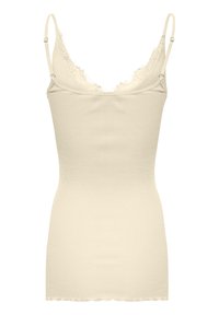 Ribbed tank top vaale beige värviga, õhukeste rihmadega. Omab kulunud pitsist kaelust ja lainelist äärt. Pehme tekstuur. Keha ligiliikuv disain.