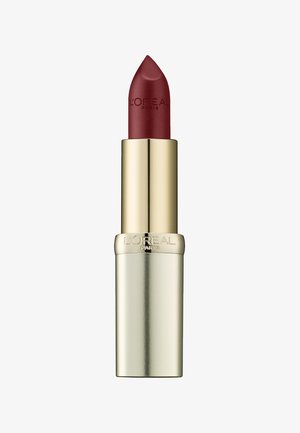 Rode matte lippenstift in een gouden en zilveren metallic tube. De dop heeft een glanzende gouden afwerking met de ingedrukte merknaam aan de zijkant.