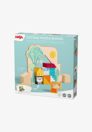 Colorful wooden cottage puzzle blocks with animal faces, trees, and sun on packaging for children aged 3 and up, including 33 pieces and 2-in-1 play options.