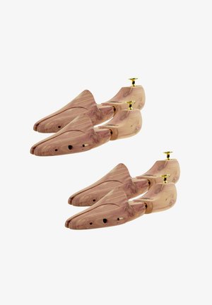 Vier Holzschuhspanner mit Messingknöpfen, in zwei Paaren auf weißem Hintergrund angeordnet.