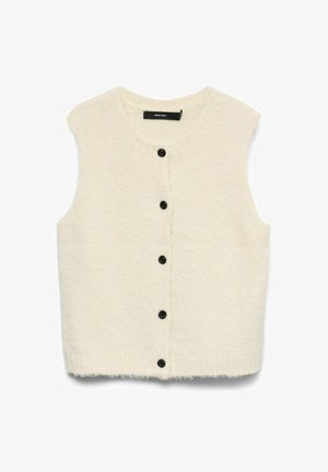 Elfenbensfärgad stickad väst med rund halsringning, ärmlös design och sex svarta knappar framtill. Mjuk textur med fransig nederkant.